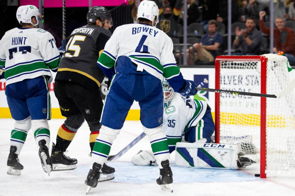 Golden Knights center Jake Leschyshyn (15) scores a goal on Canucks goaltender Thatcher Demko ( ...