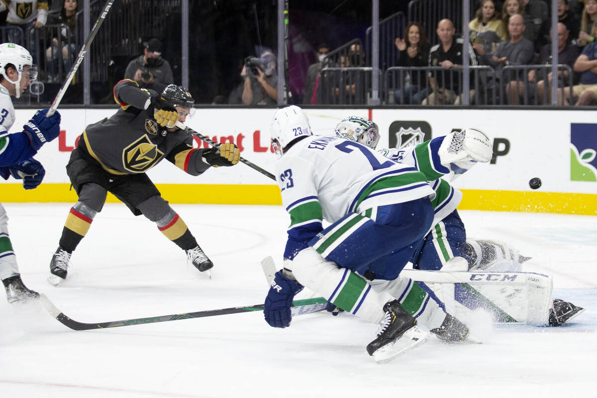 Golden Knights right wing Evgenii Dadonov (63) scores a goal on Canucks goaltender Thatcher Dem ...