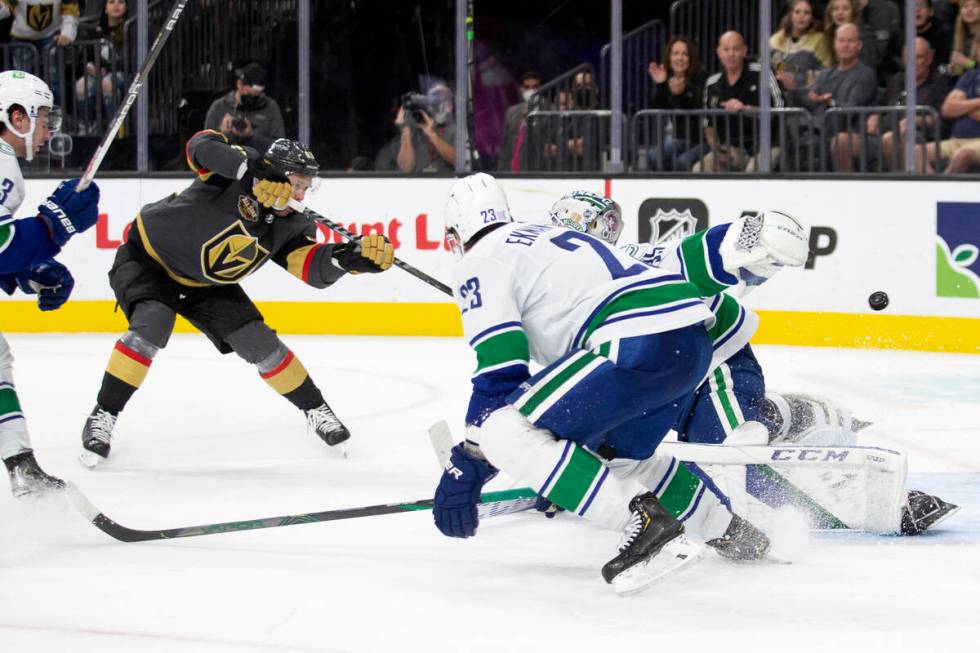 Golden Knights right wing Evgenii Dadonov (63) scores a goal on Canucks goaltender Thatcher Dem ...