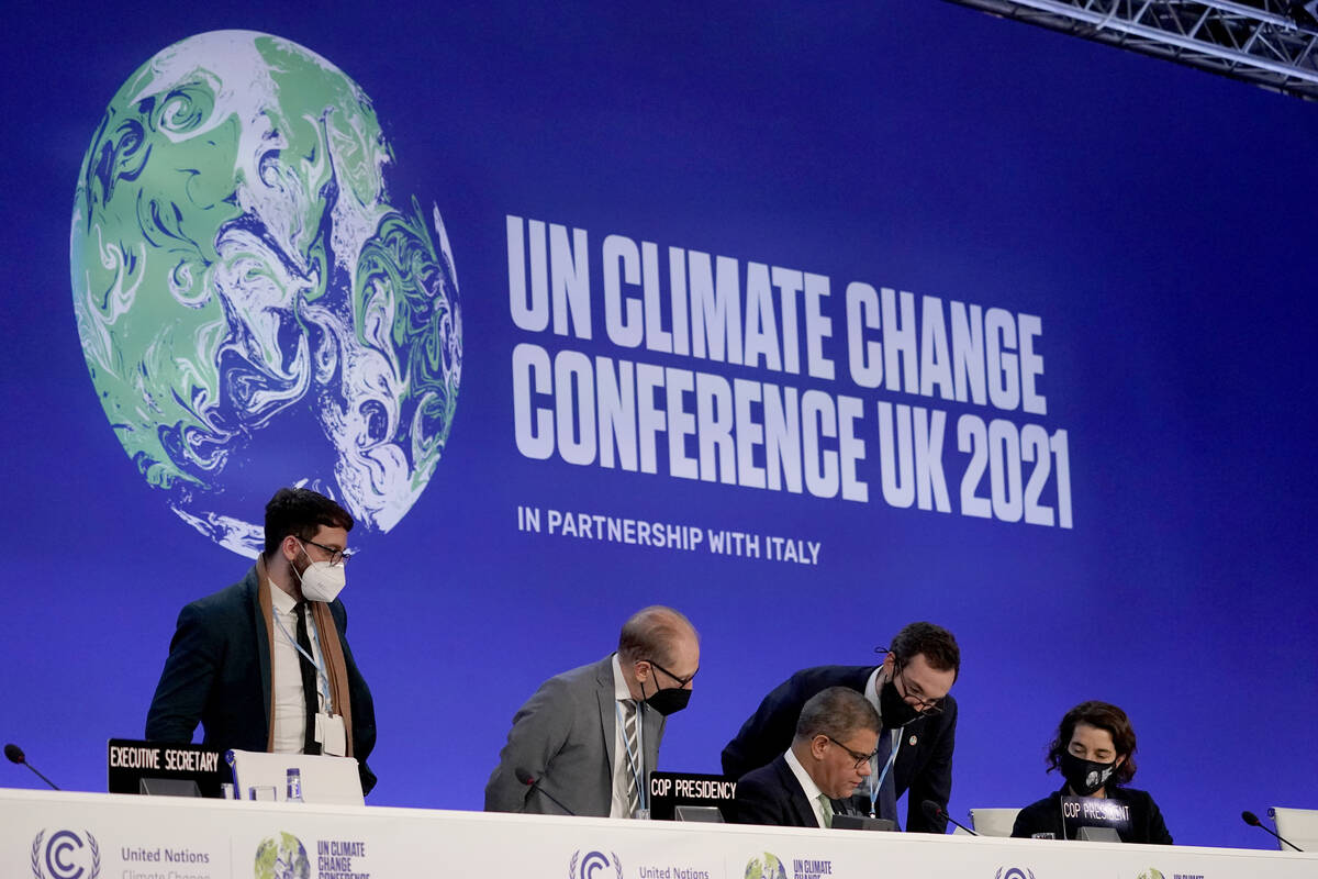 Alok Sharma, centre seated, President of the COP26 summit attends a stocktaking plenary session ...