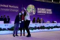 Delegates pose for a selfie together in the plenary room at the COP26 U.N. Climate Summit, in G ...
