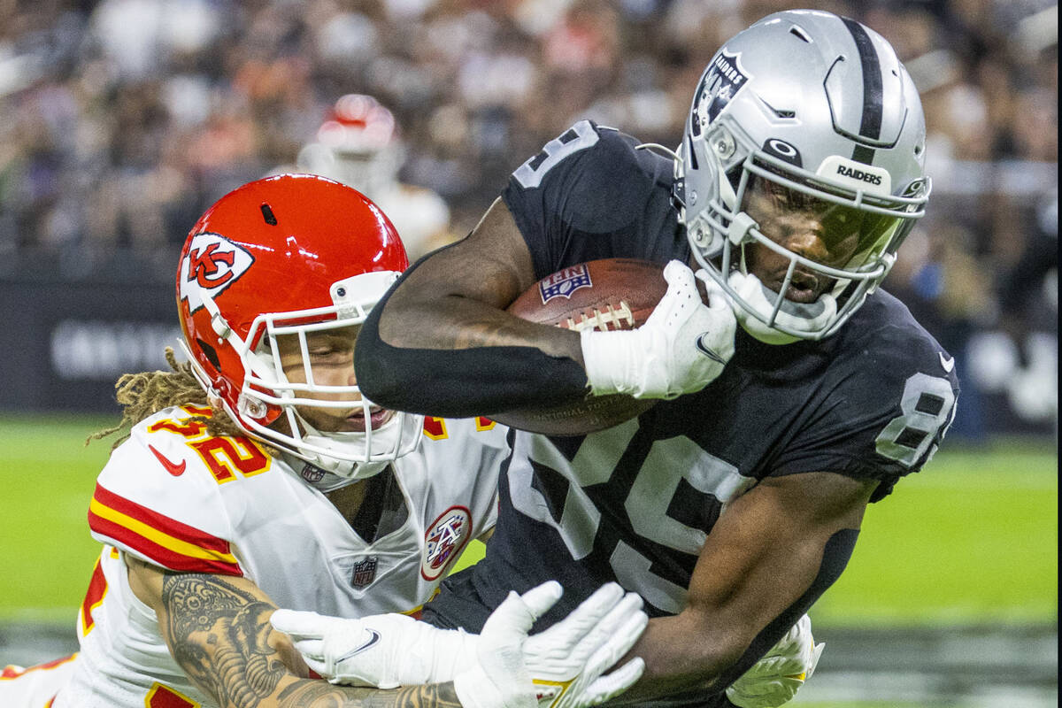 Raiders wide receiver Bryan Edwards (89) attempts to break tackle by Kansas City Chiefs free sa ...