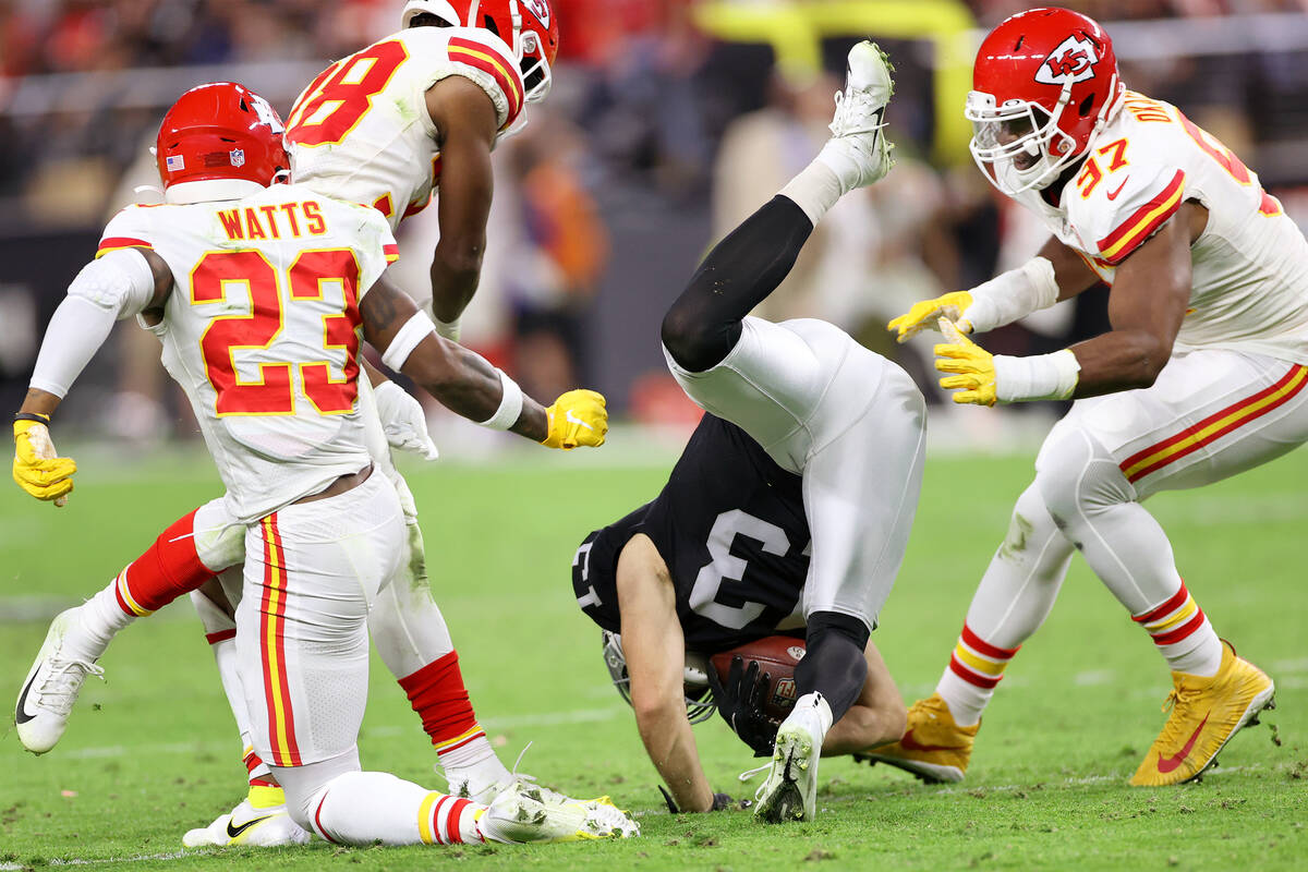 Kansas City Chiefs cornerback L'Jarius Sneed (38) tackles Raiders quarterback Nathan Peterman ( ...