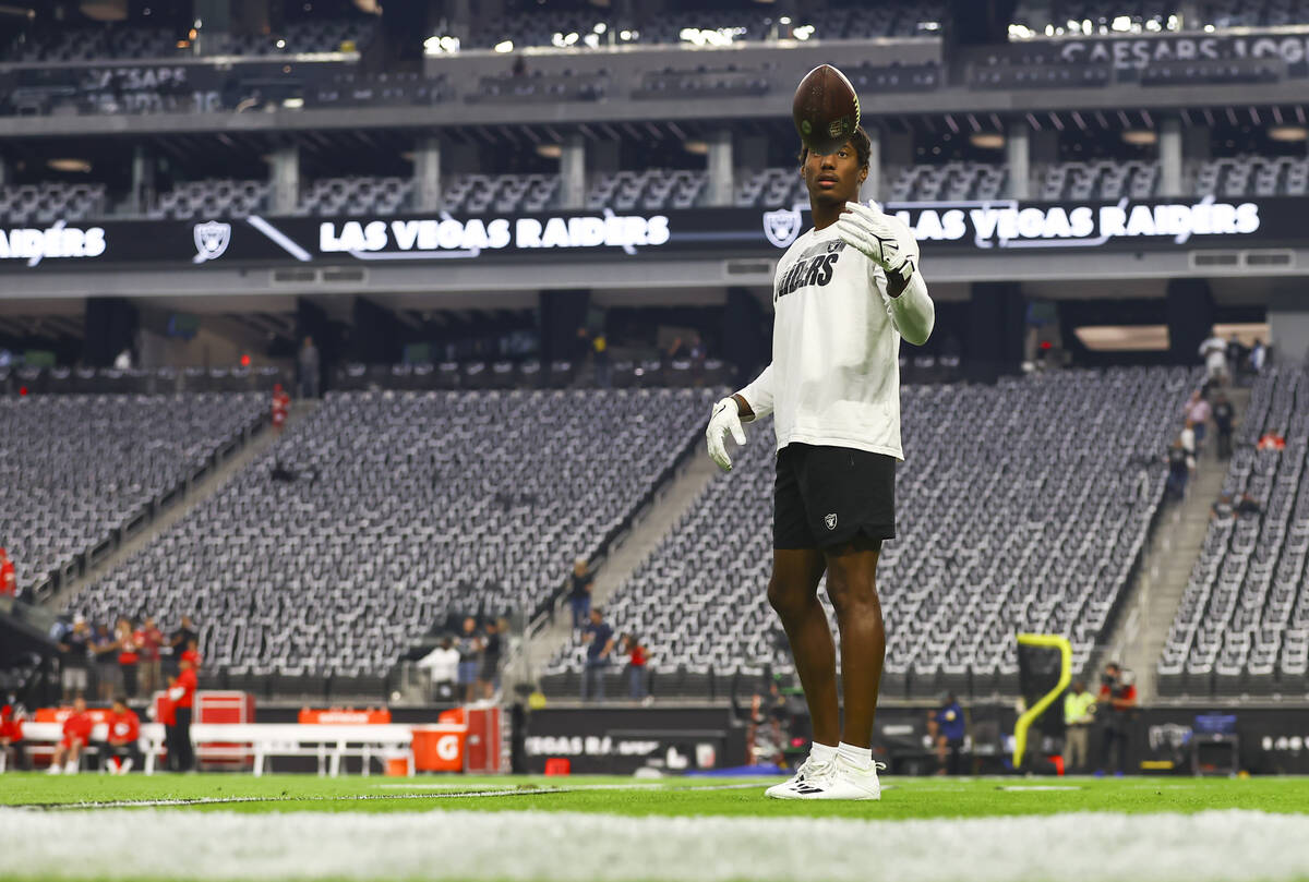 Raiders wide receiver Zay Jones warms up before the start of an NFL game against the Kansas Cit ...