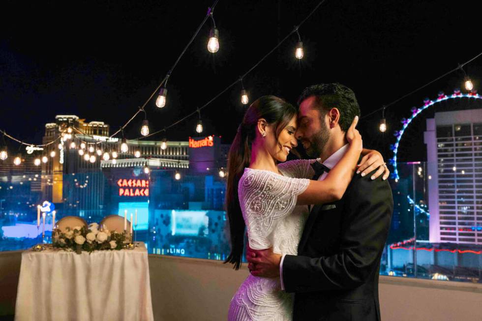 The Las Vegas skyline provides a romantic backdrop for a couple in this image from the LVCVA's ...