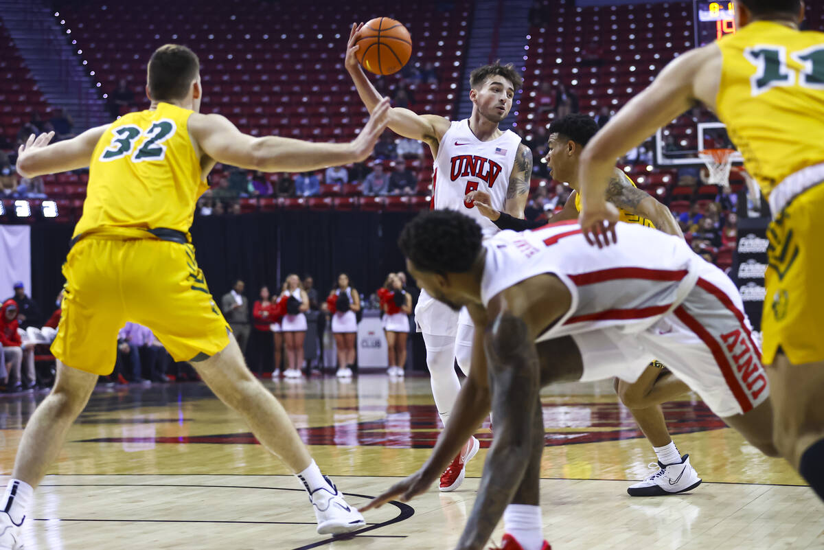 UNLV Rebels guard Jordan McCabe (5) looks to pass the ball during the first half of an NCAA bas ...
