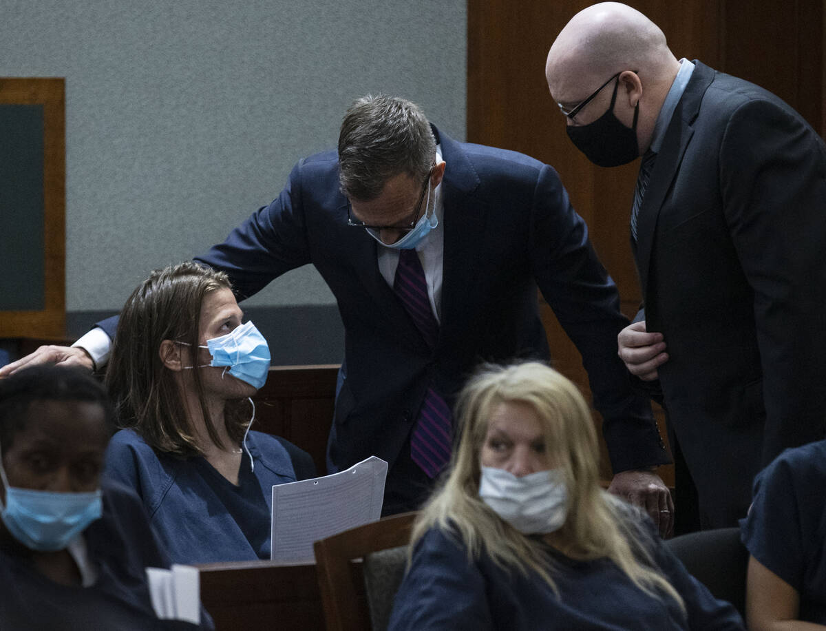 Erik Legried, left, the suspect in the Red Rock OIS from last week, discusses with his attorney ...