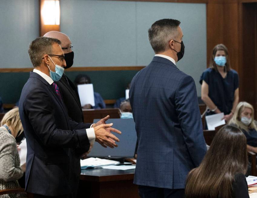 Prosecutor Giancarlo Pesci, center, listens as Defense attorney William Brown, left, representi ...