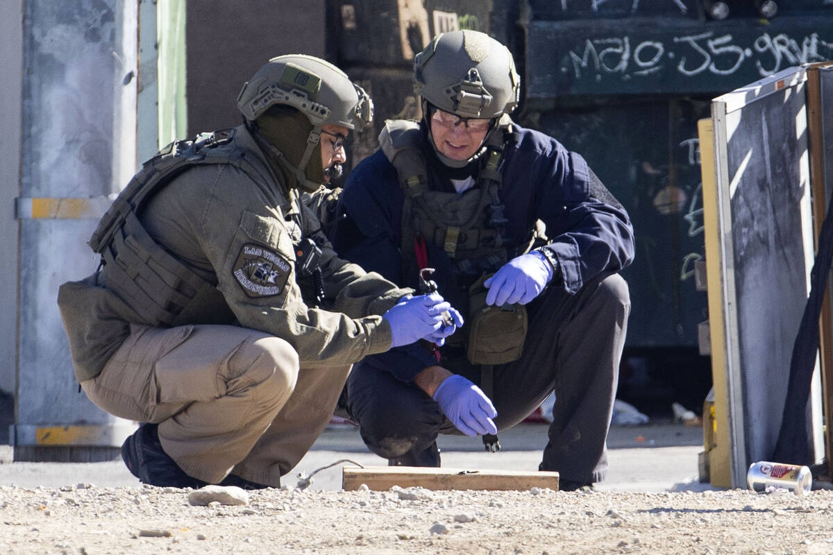The Las Vegas Fire Department bomb squad officers prepare to investigate a suspicious device in ...