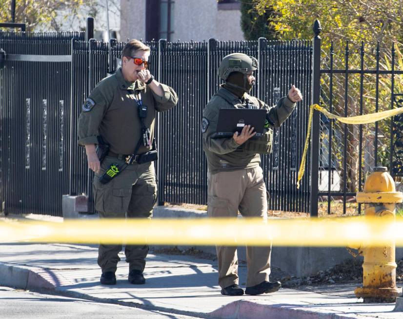 The Las Vegas Fire Department bomb squad officers are investigating a suspicious device in down ...