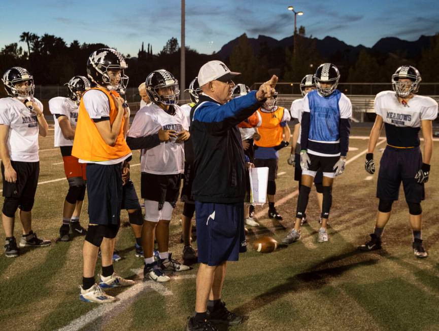 The Meadows High School defensive coordinator Rodney Vollan directs his players during practice ...