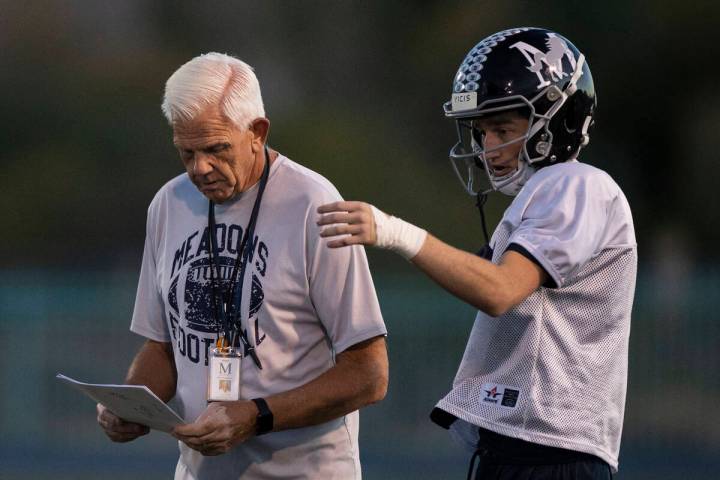 The Meadows High School football head coach Jack Concannon, left, discusses the game plan with ...