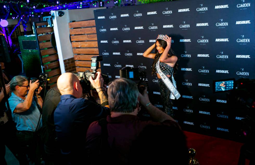 Photographers take pictures Miss Nevada USA Kataluna Enriquez as she arrives for her victory pa ...
