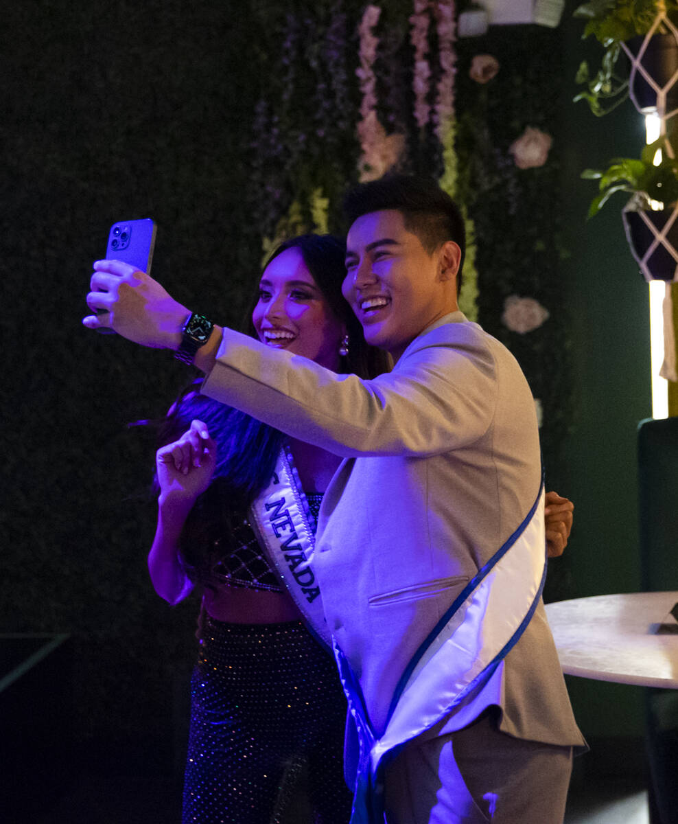 Jack Titus, Mr. Gay World Nevada 2021, right, takes a selfie with Miss Nevada USA Kataluna Enri ...
