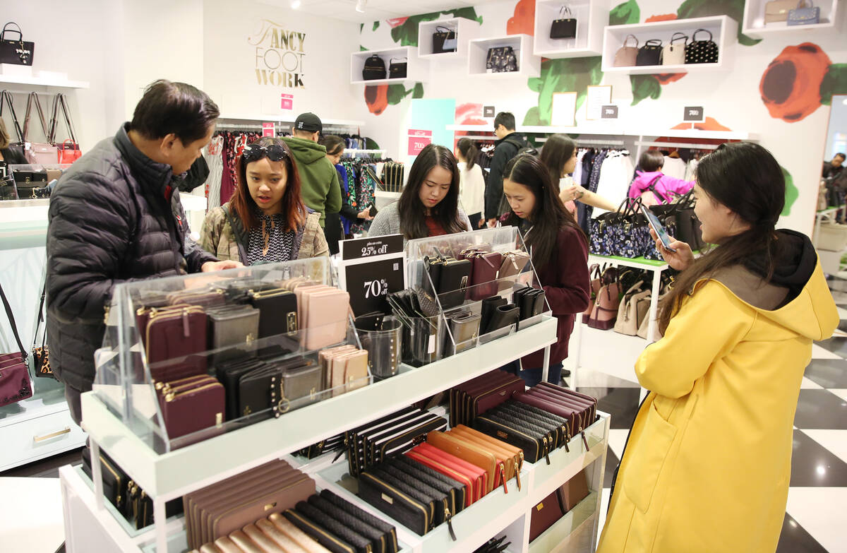 Black Friday sale shoppers shop at Kate Spade New York bag store at the North Premium Outlet on ...