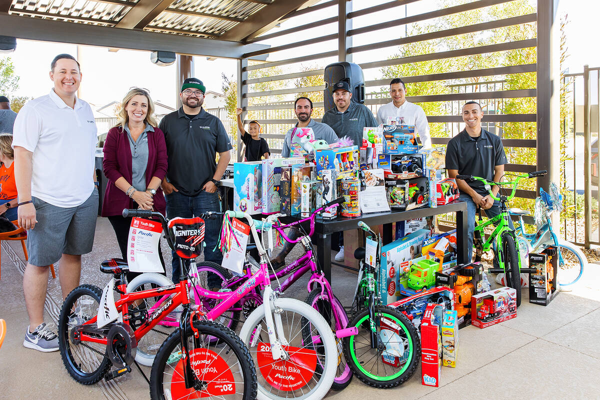 The team at Tri Pointe homes held a toy drive event at Inspirada to benefit HELP of Southern Ne ...