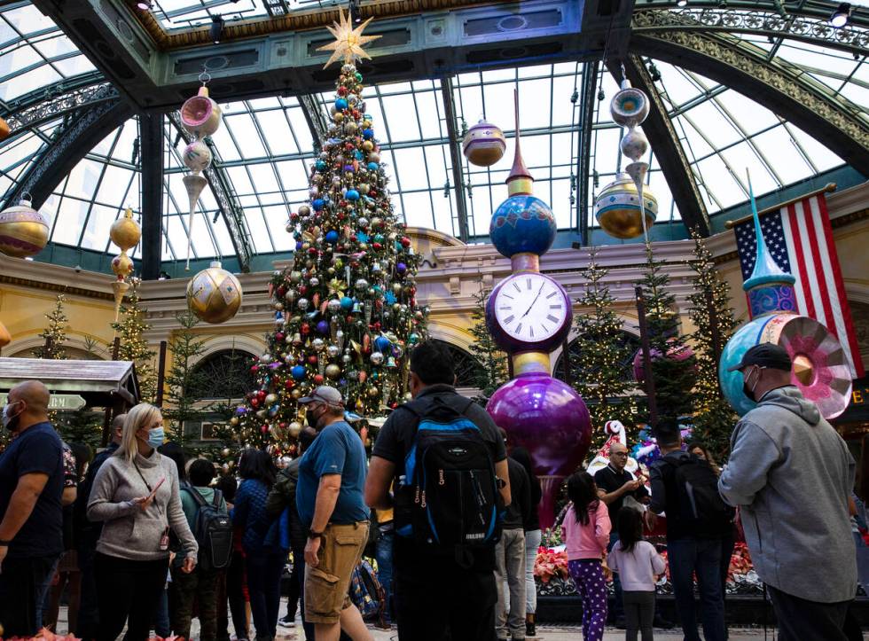 Tourists visit the Bellagio Conservatory's holiday display 'Holiday Time.' (Bizuayehu Tesfaye/L ...