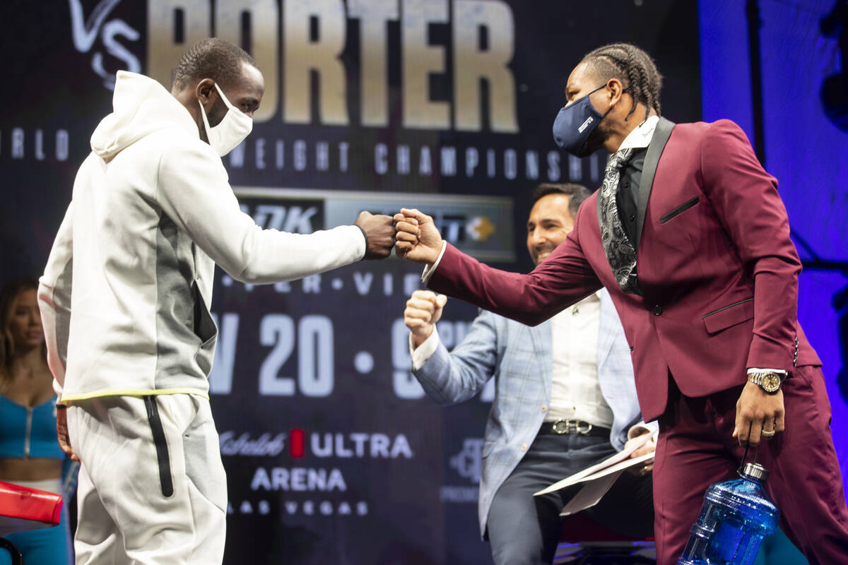 Terence Crawford, left, and Shawn Porter greet each other before the start of their press confe ...