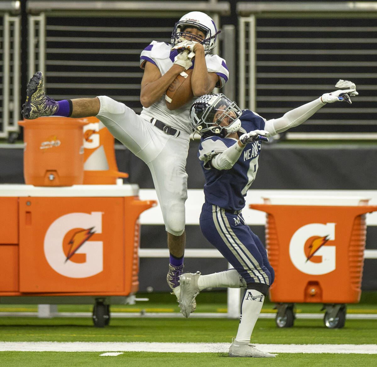Yerington receiver Donovan Martinez (1) goes up high for a pass attempt over The Meadows defens ...