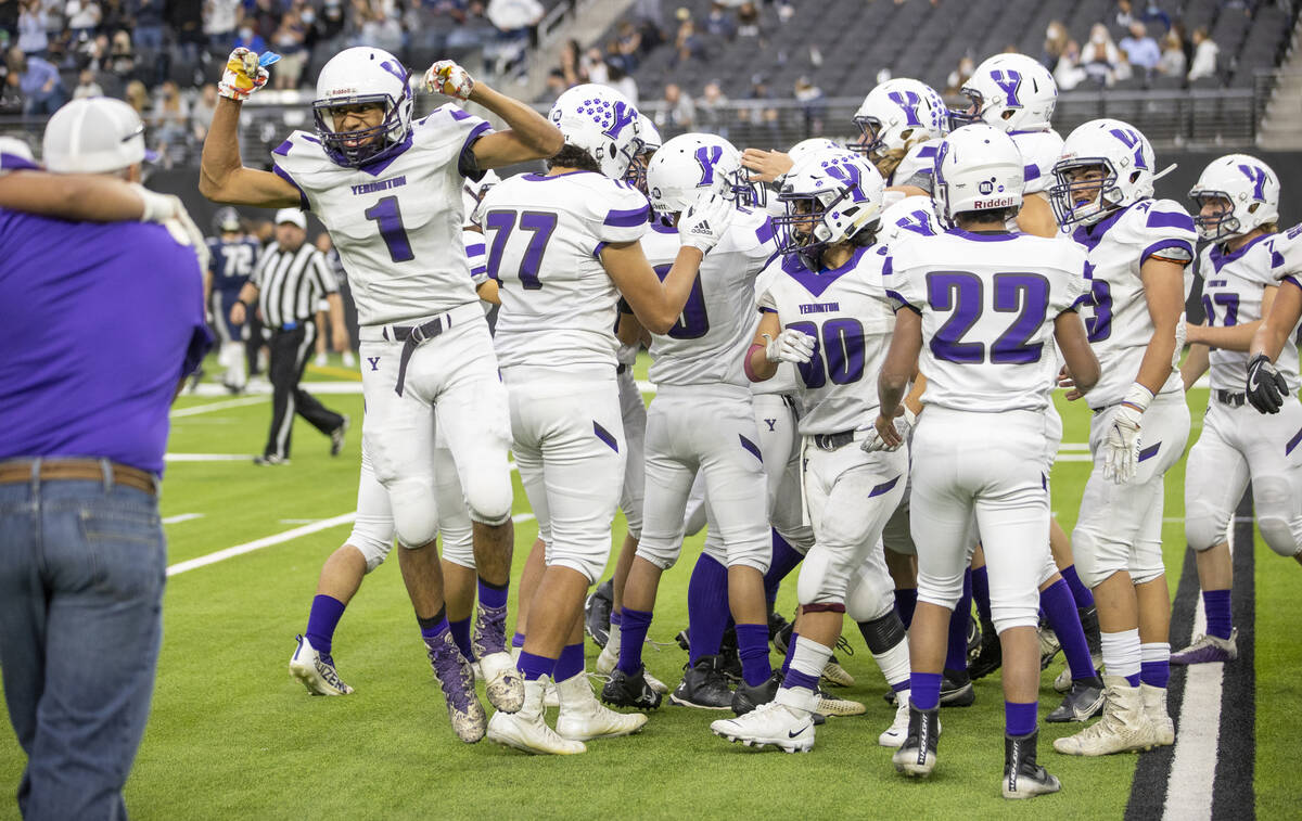 Yerington players celebrate their win over The Meadows following the second half of their Class ...