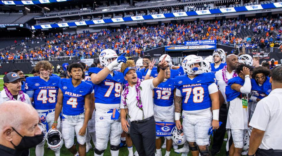 Bishop Gorman head coach Brent Browner with his team after defeating McQueen 56-7 following the ...