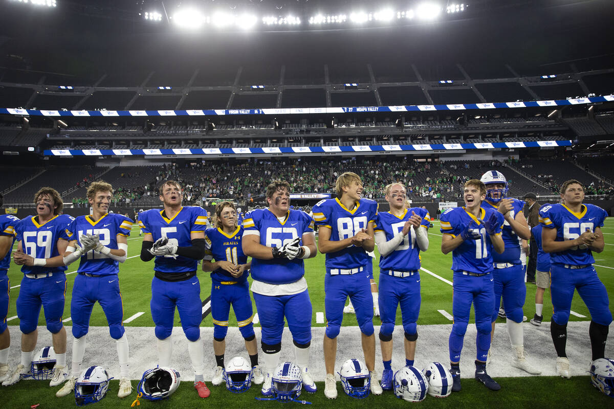 Moapa Valley players line up in front of their fan section after winning the Class 3A football ...