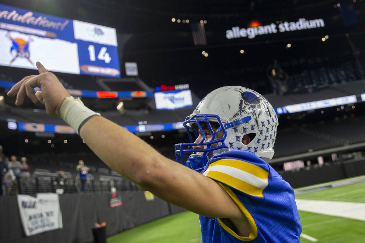 Moapa Valley running back Jayme Carvajal (7) holds up the number one to fans after winning the ...