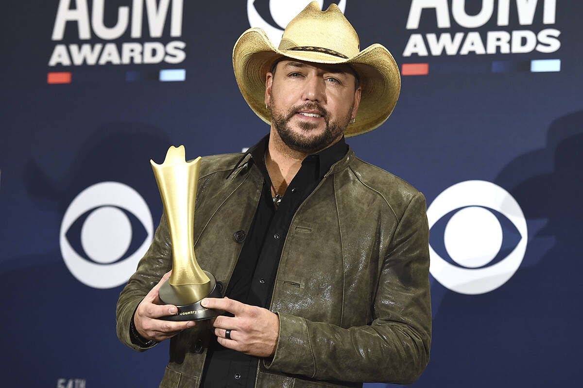 Jason Aldean poses in the press room with the Dick Clark artist of the decade award at the 54th ...