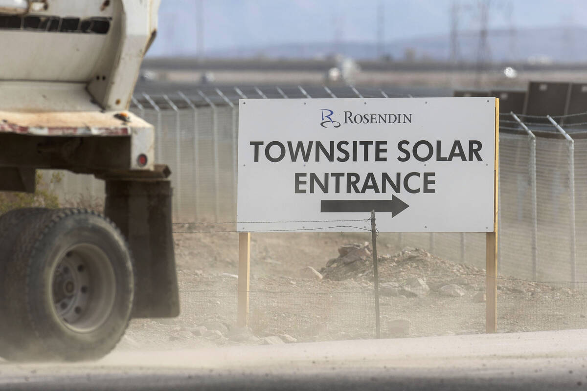 A truck blows dust as it leaves Townsite Solar Garden at 3316 South US Highway 95, on Friday, N ...