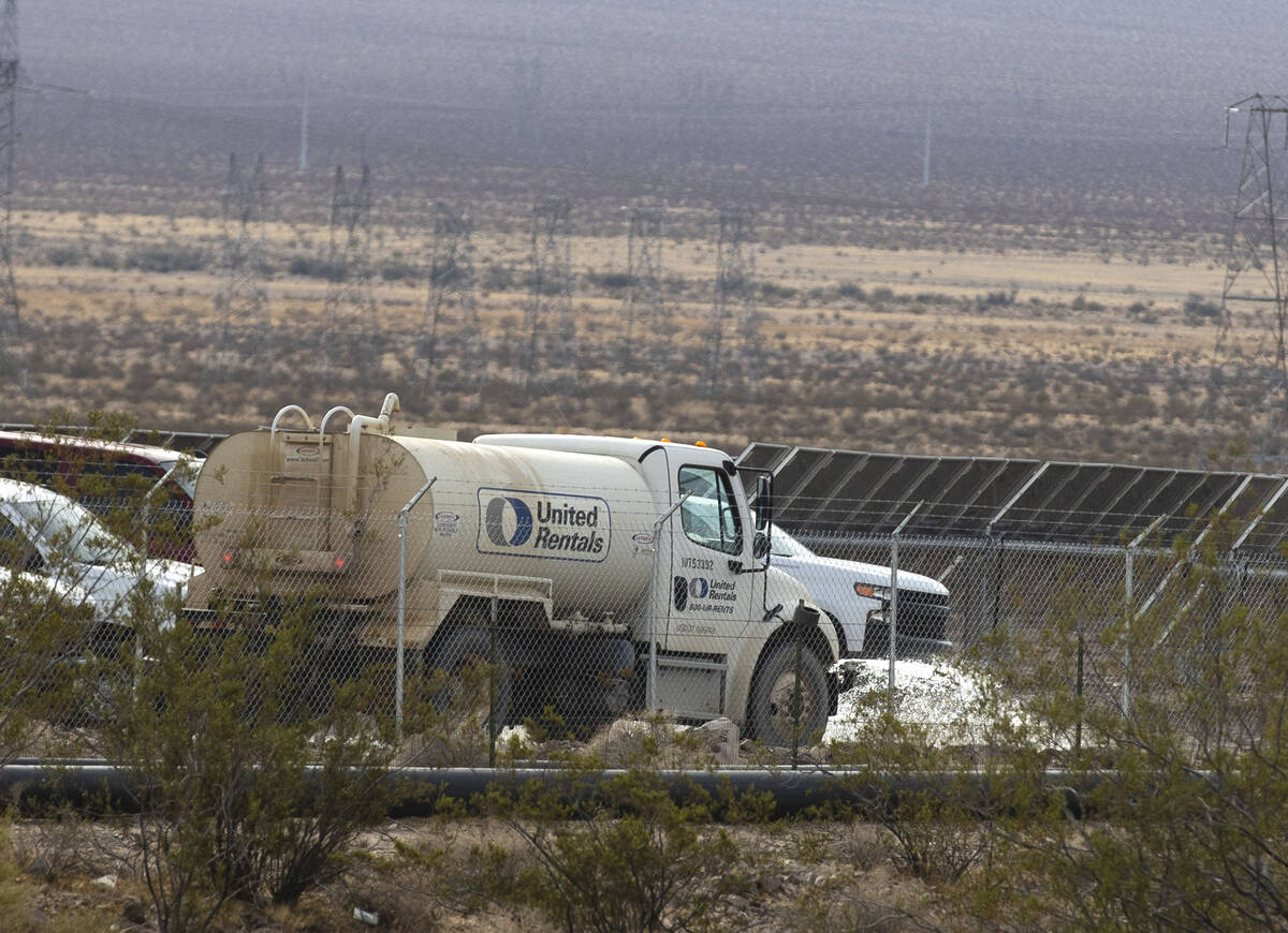 A water truck sprays water at Townsite Solar Garden at 3316 South US Highway 95, on Friday, Nov ...