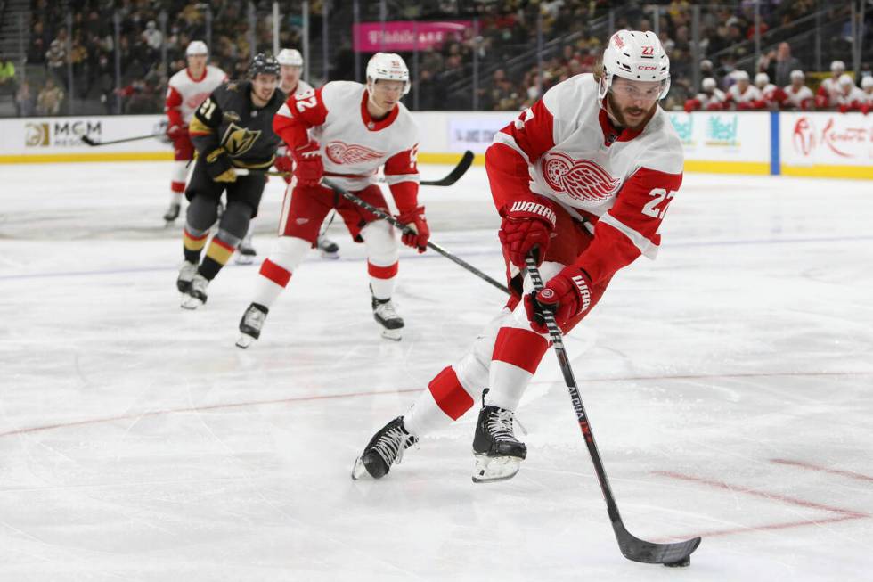 Detroit Red Wings center Michael Rasmussen (27) advances the puck during the first period of an ...