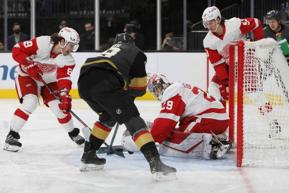 Detroit Red Wings goaltender Thomas Greiss (29) covers up the puck against Vegas Golden Knights ...