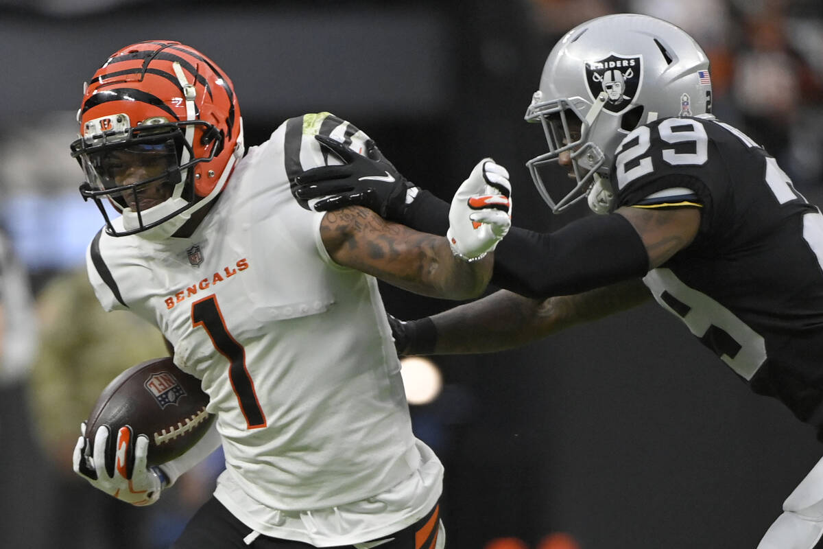 Cincinnati Bengals wide receiver Ja'Marr Chase (1) runs against Las Vegas Raiders cornerback Ca ...