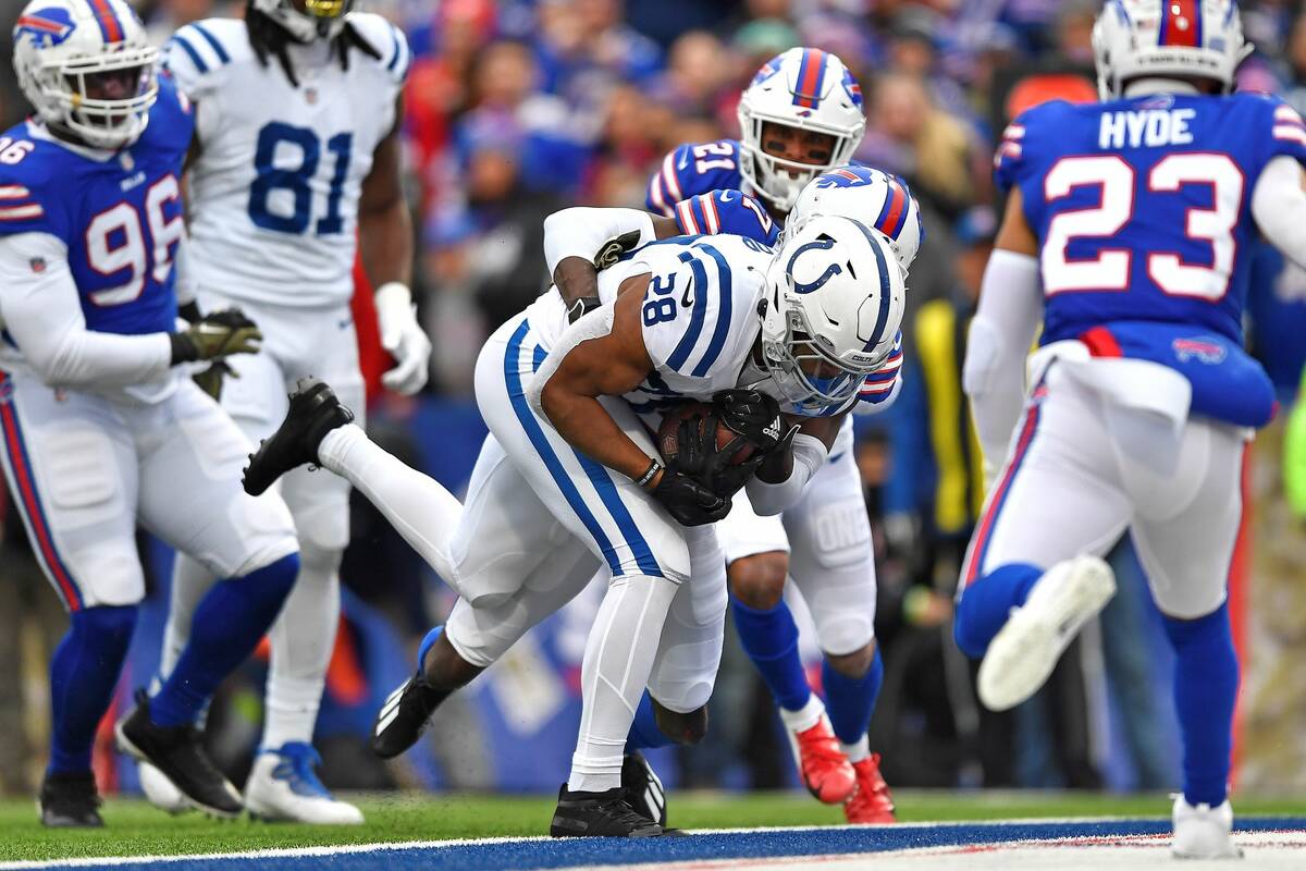 Indianapolis Colts running back Jonathan Taylor (28) scores during the first half of an NFL foo ...