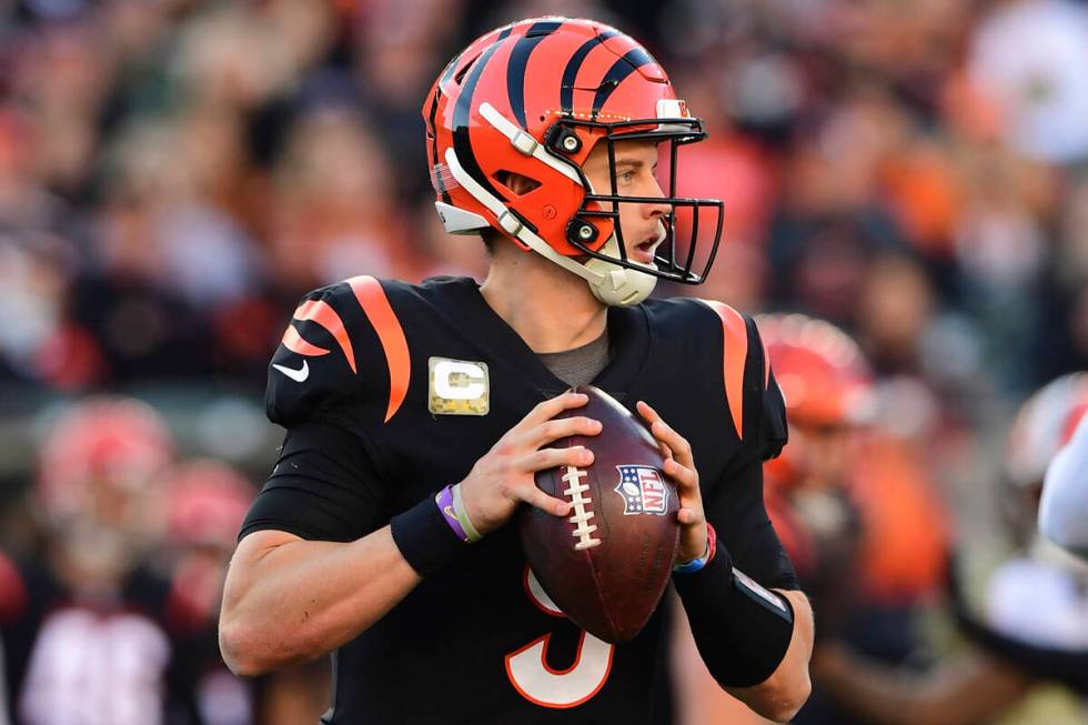 Cincinnati Bengals quarterback Joe Burrow (9) drops back to pass during an NFL football game ag ...