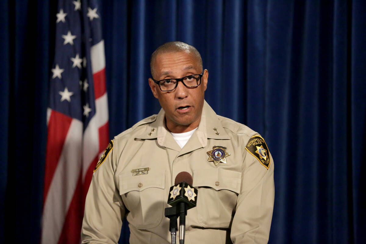 Assistant Sheriff Charles Hank briefs the media on the latest officer involved shooting at Las ...