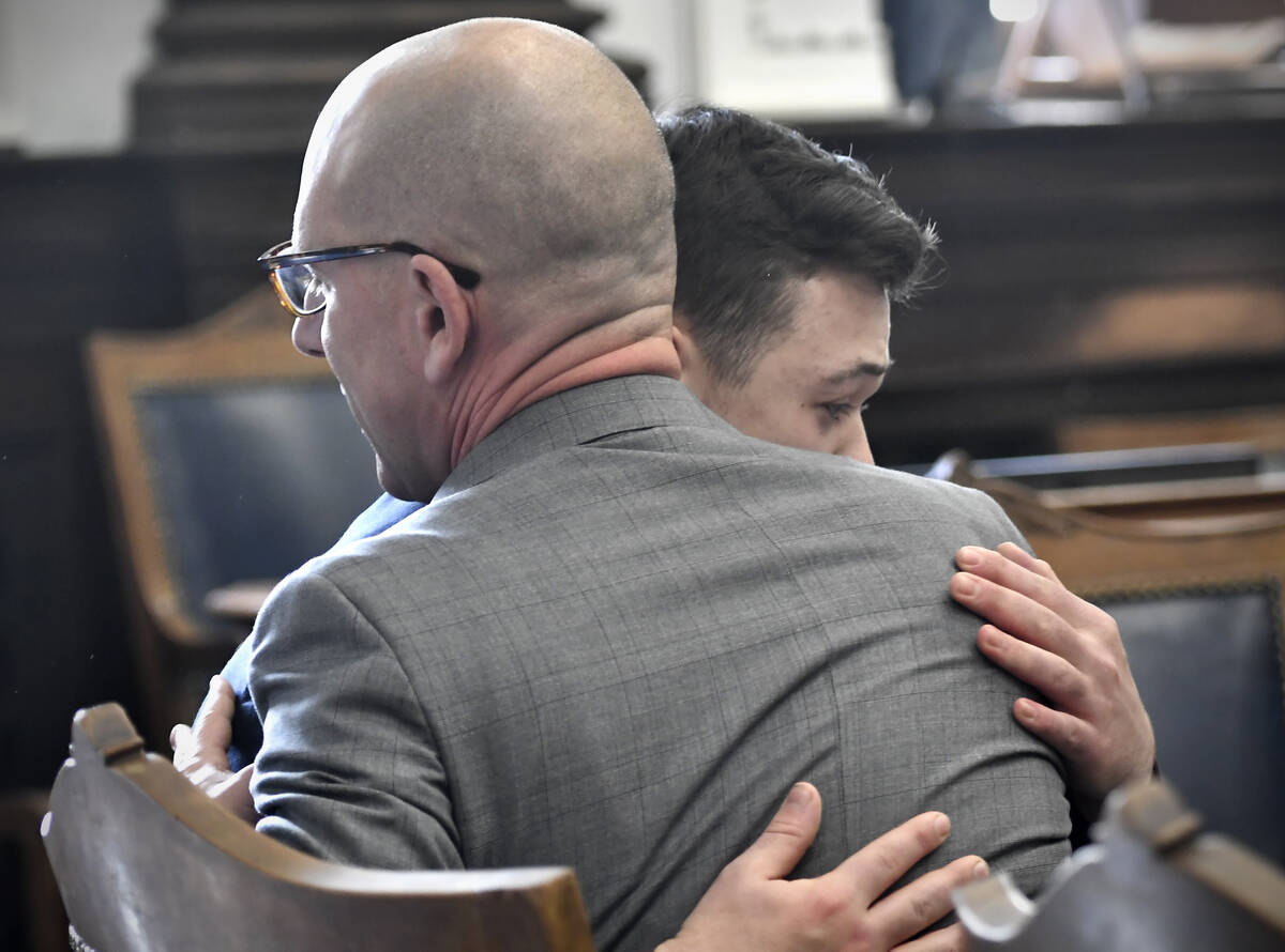 Kyle Rittenhouse hugs one of his attorneys, Corey Chirafisi, after he is found not guilt on all ...