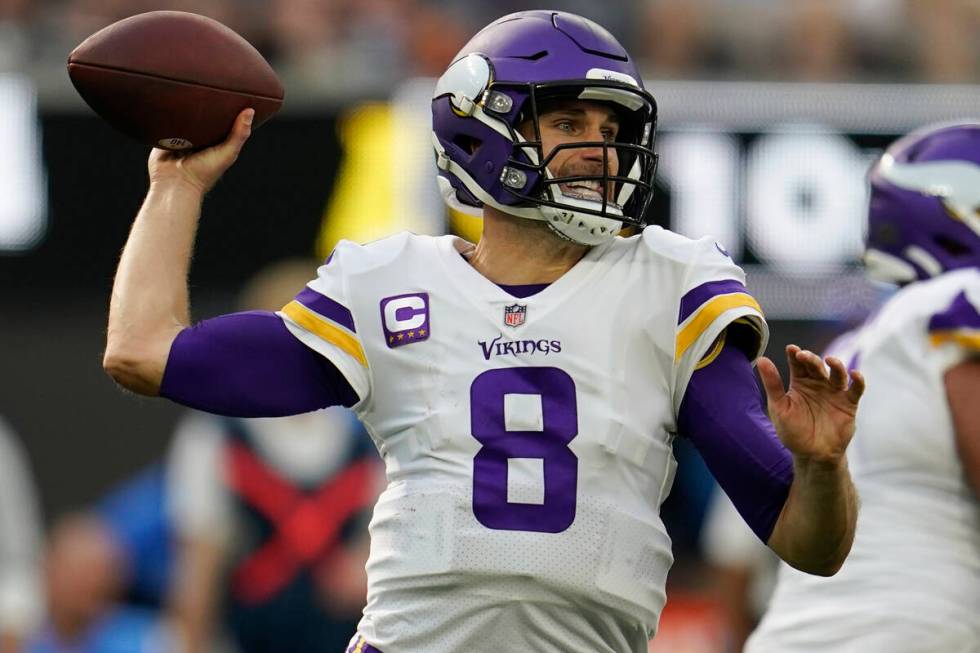 Minnesota Vikings quarterback Kirk Cousins (8) prepares to throw a pass during the first half o ...
