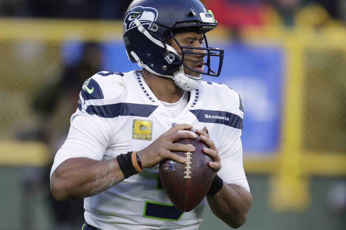 Seattle Seahawks' Russell Wilson during the first half of an NFL football game against the Gree ...