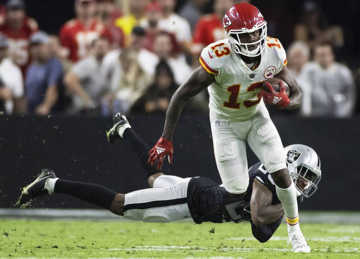 Kansas City Chiefs wide receiver Byron Pringle (13) breaks free from Raiders cornerback Casey H ...