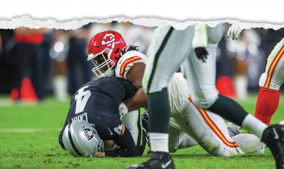 Raiders quarterback Derek Carr (4) is sacked by Kansas City Chiefs defensive tackle Derrick Nna ...