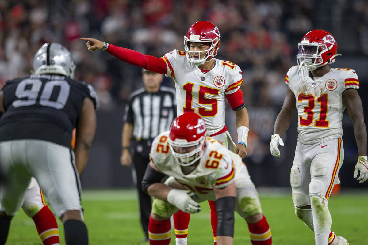 Kansas City Chiefs quarterback Patrick Mahomes (15) audibles at the line of scrimmage during th ...