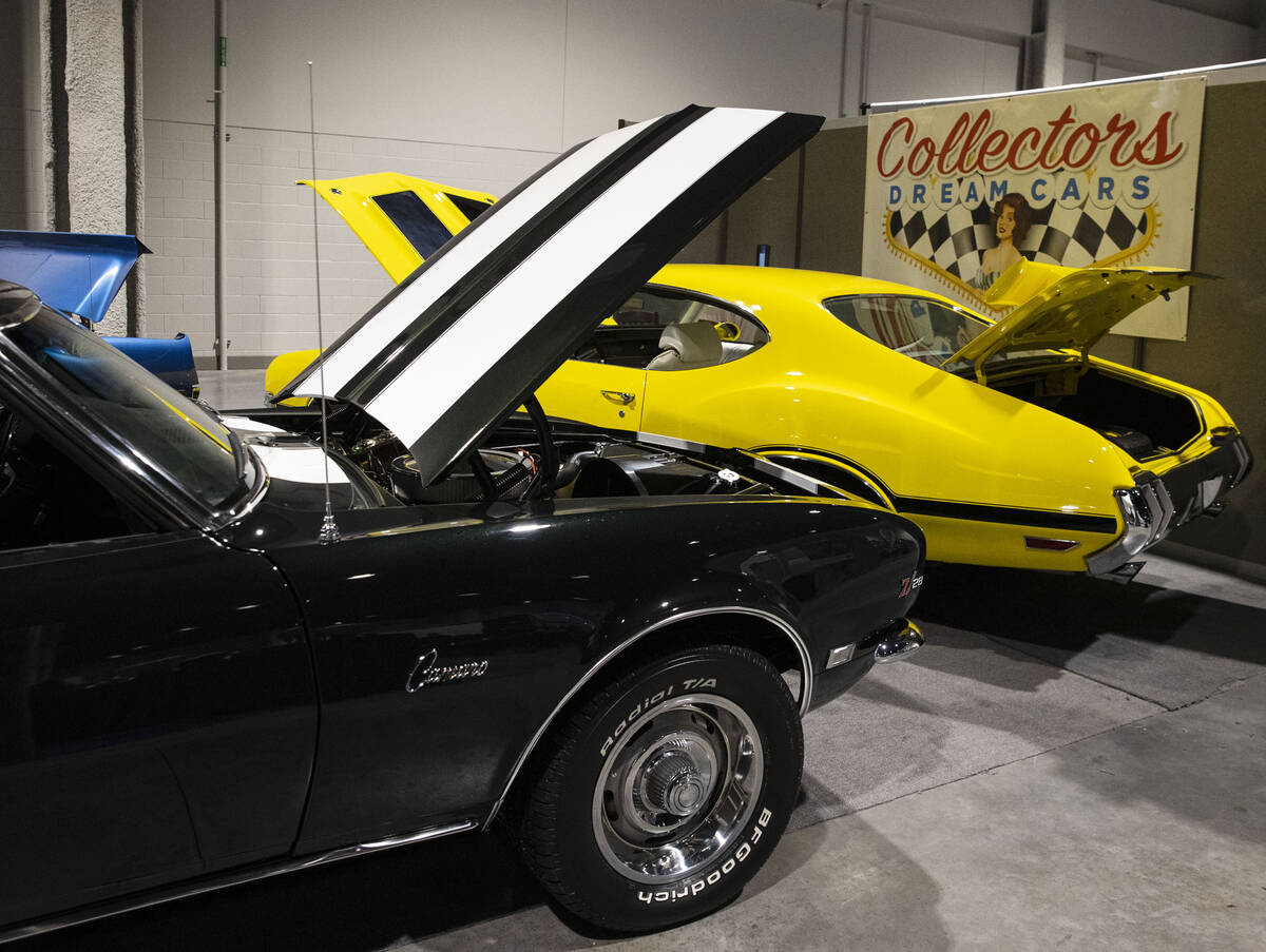 A 1968 Chevy Camaro Z28, left, and a 1970 Oldsmobile 442 are displayed at Big Boys Toys, the wo ...