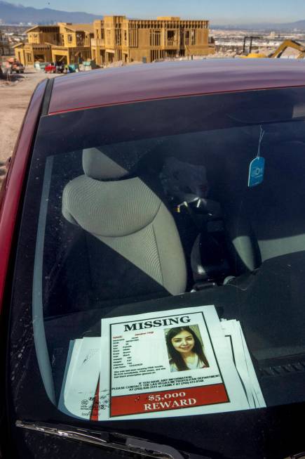 Flyers sit on the dash in Jawaher Hejji's car, which was left at this spot near the Amargosa Tr ...