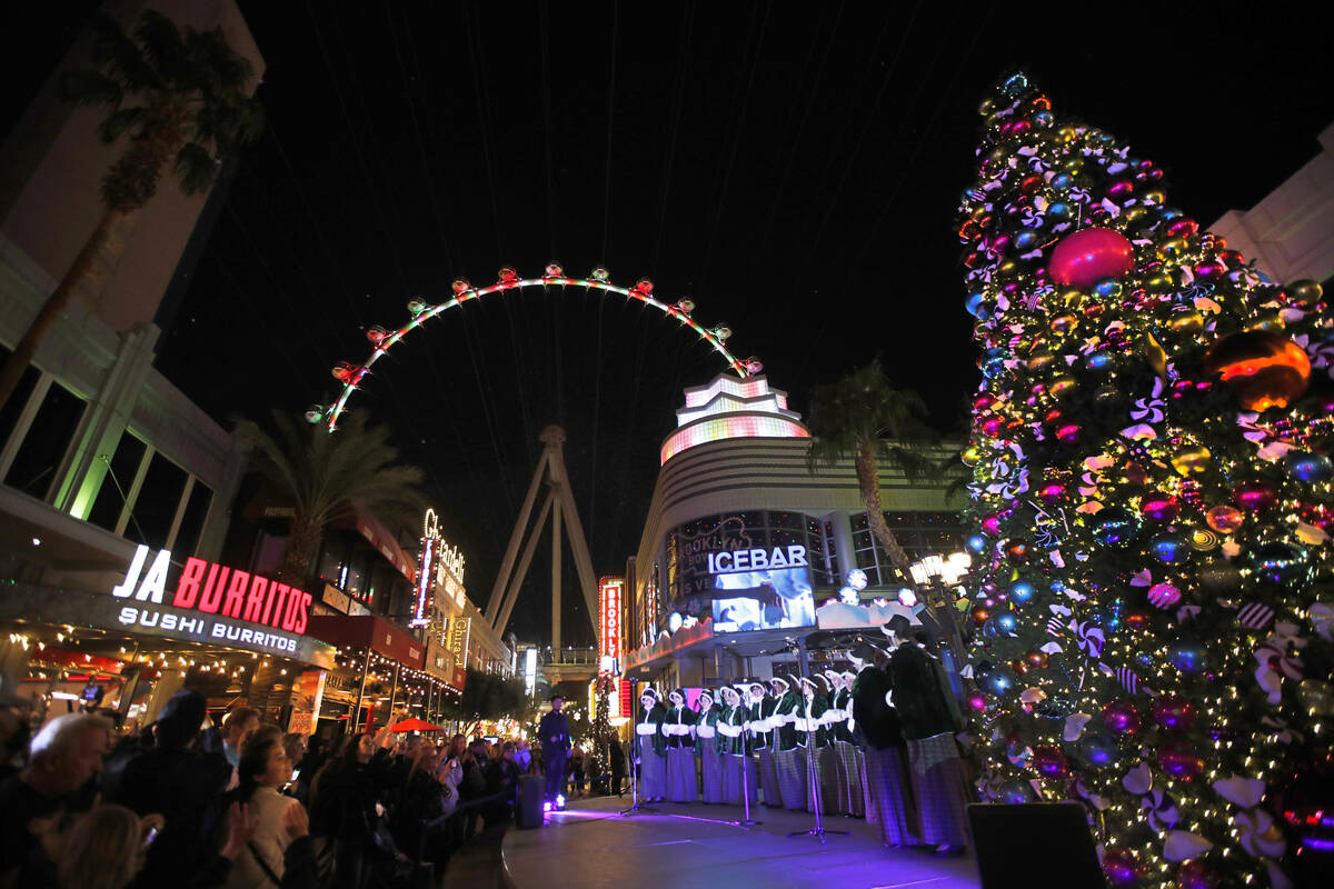 Las Vegas Academy of the Arts Choir members perform during a holiday celebration of The Linq Pr ...