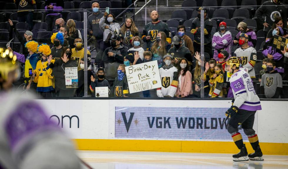 Golden Knights fans watch and cheer during warm up before the first period of an NHL game at T- ...