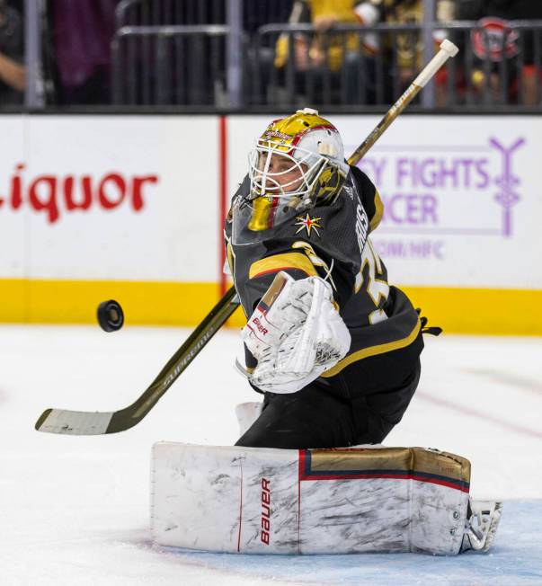 Golden Knights goaltender Laurent Brossoit (39) stops a shot from the Columbus Blue Jackets dur ...