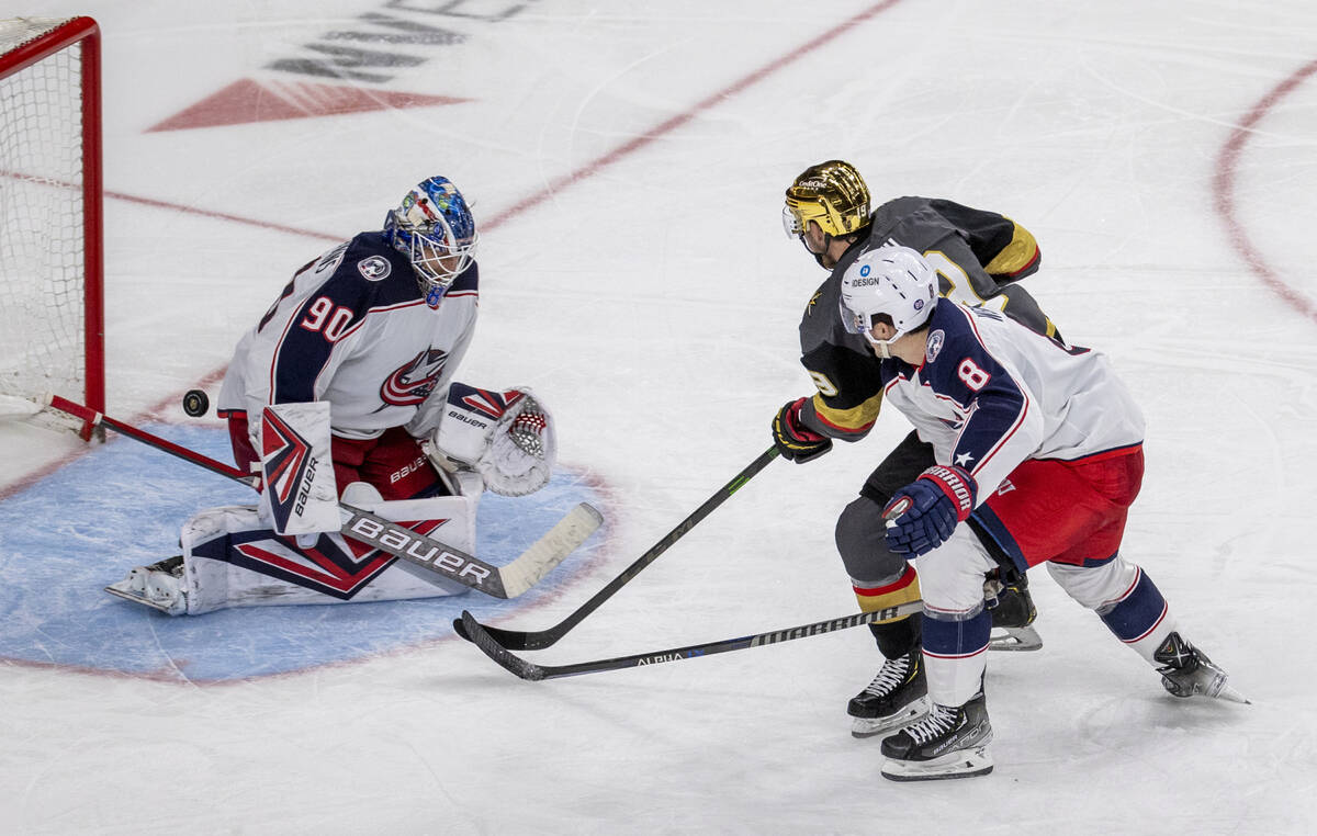 Golden Knights right wing Reilly Smith (19) scores on Columbus Blue Jackets goaltender Elvis Me ...