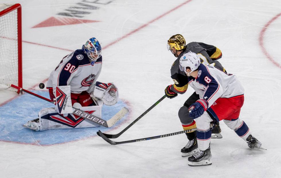 Golden Knights right wing Reilly Smith (19) scores on Columbus Blue Jackets goaltender Elvis Me ...