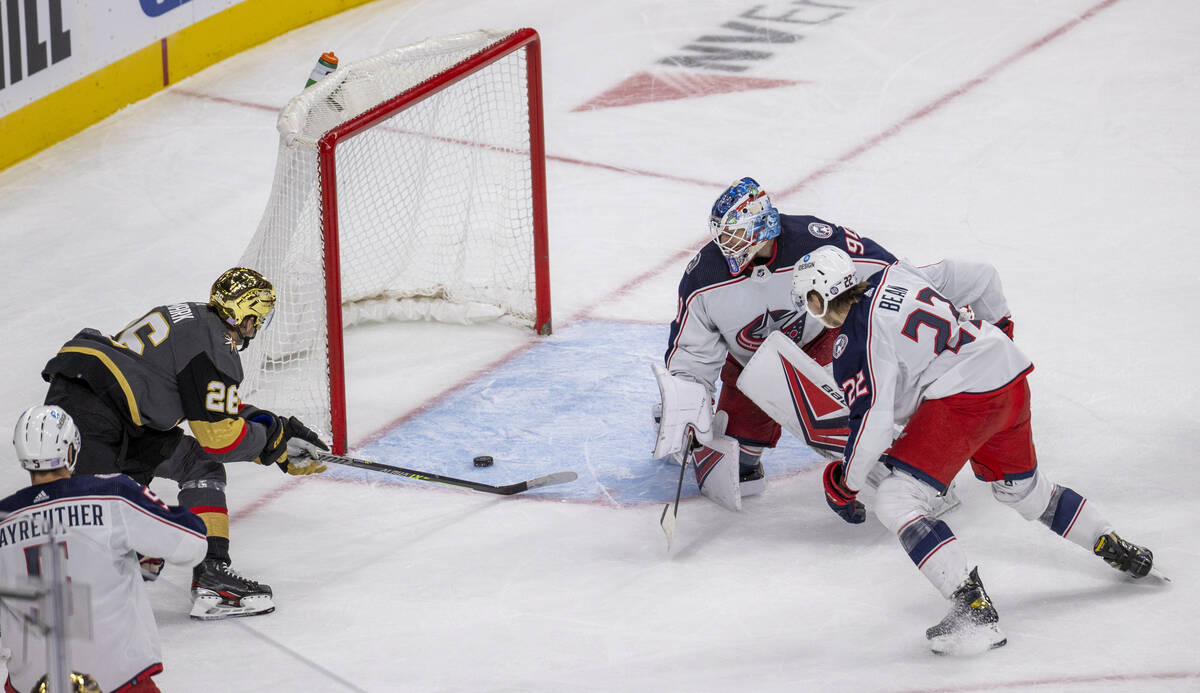 Golden Knights center Mattias Janmark (26) sends the puck into the net past Columbus Blue Jacke ...